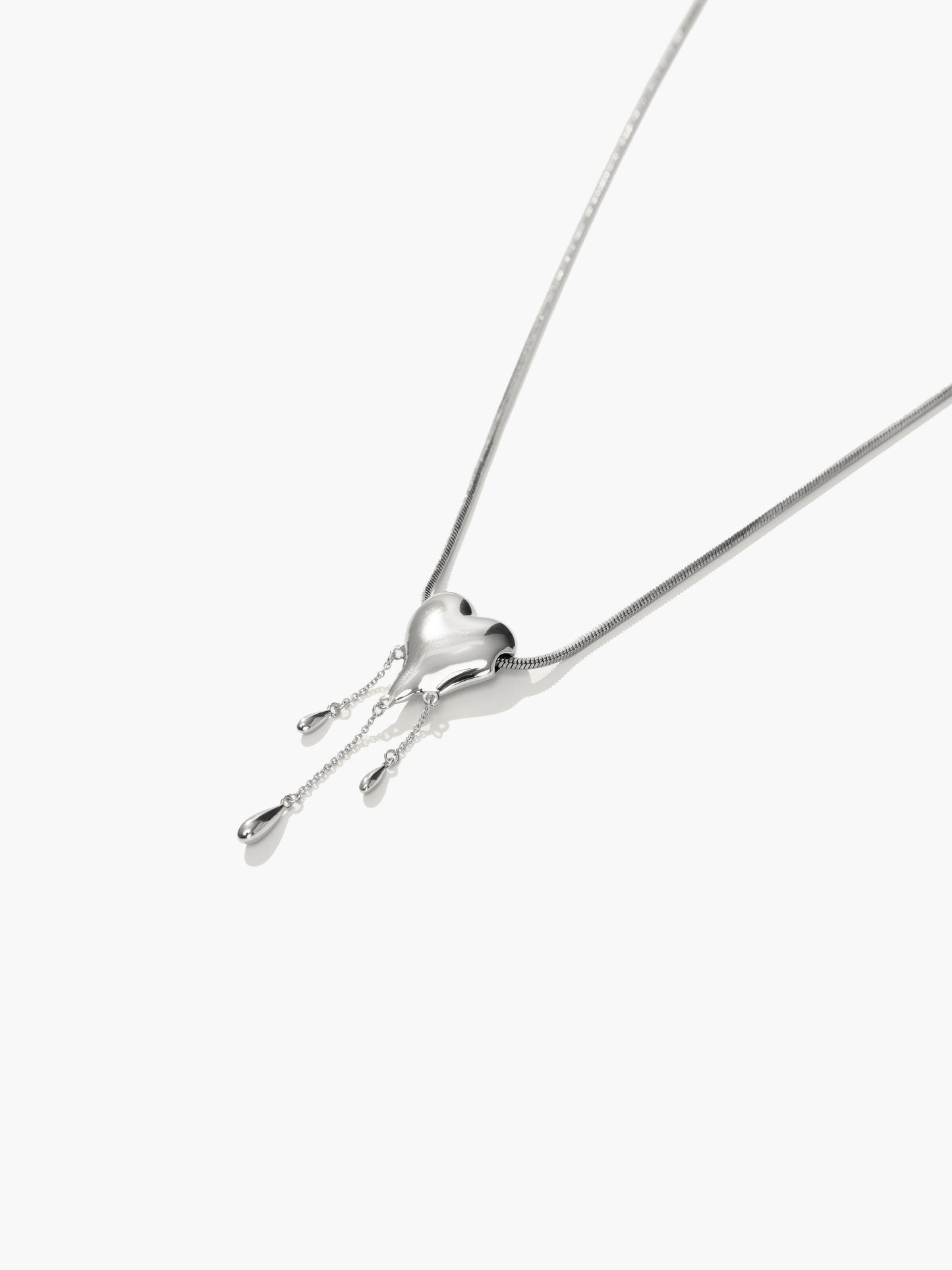 Venom’s Golden Drip Heart Necklace in Silver