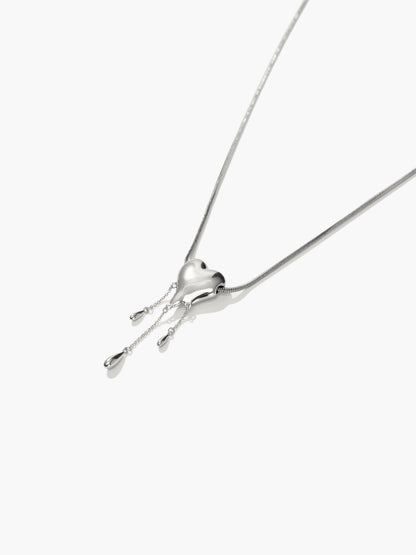 Venom’s Golden Drip Heart Necklace in Silver